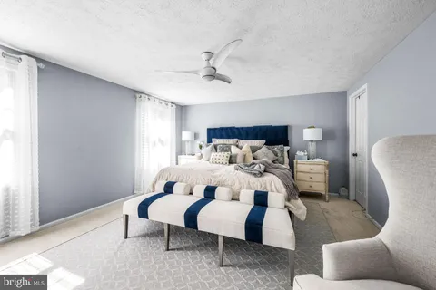 a bed room with a bed and a couch