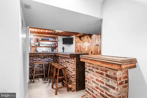 a view of an chairs and table in kitchen