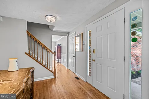 a view of entryway with wooden floor