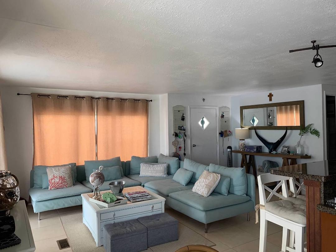 46 Ocean Drive Key Largo, FL 33037 - Photo 6 of 15 a living room with furniture and a mirror