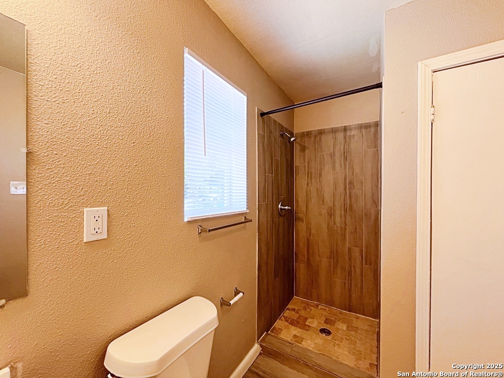 378 East Petaluma Boulevard, Unit B San Antonio, TX 78221 - Photo 17 of 25 a bathroom with a toilet and a shower