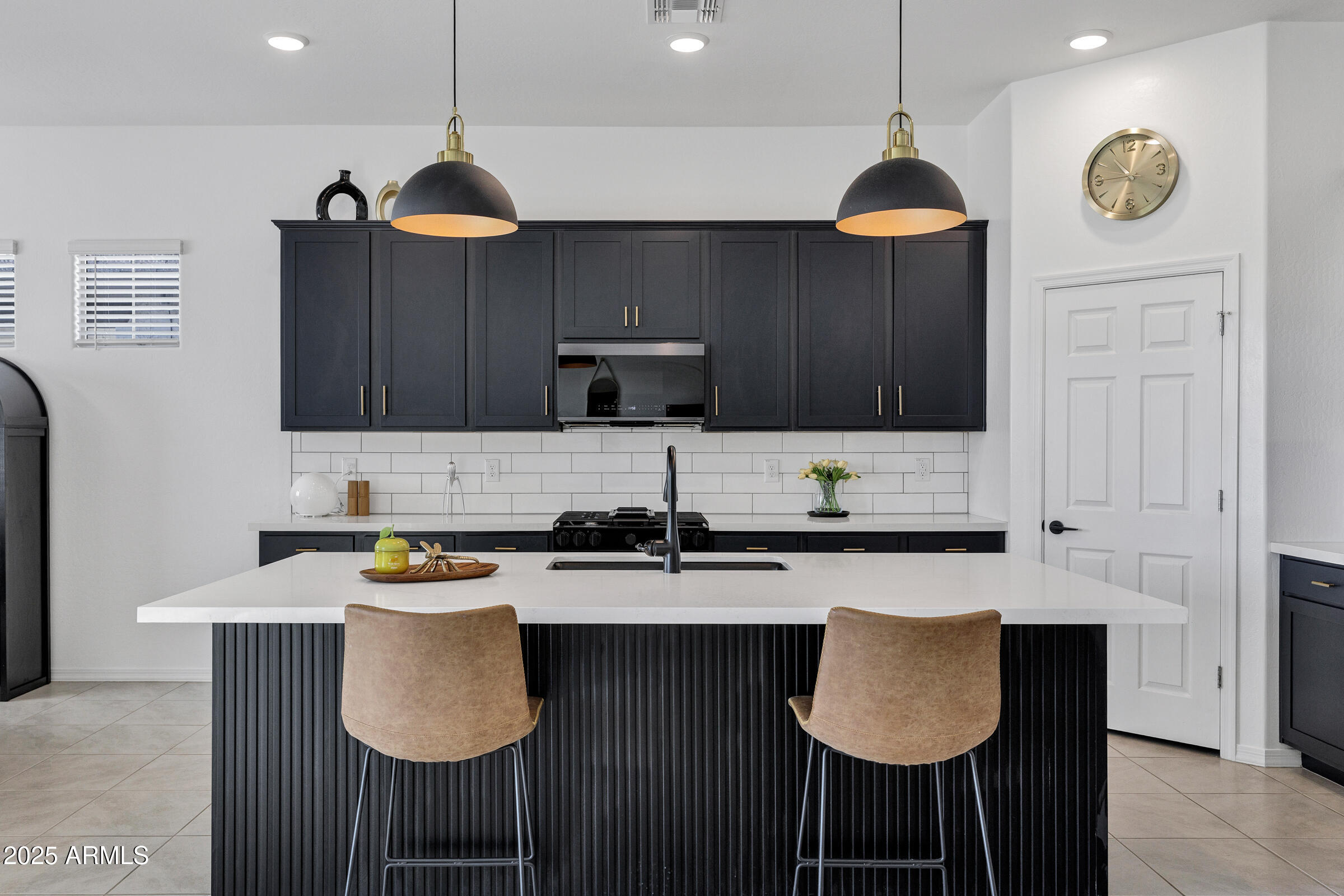 23025 East Happy Road Queen Creek, AZ 85142 - Photo 10 of 31 a kitchen with stainless steel appliances granite countertop a sink a stove and a refrigerator