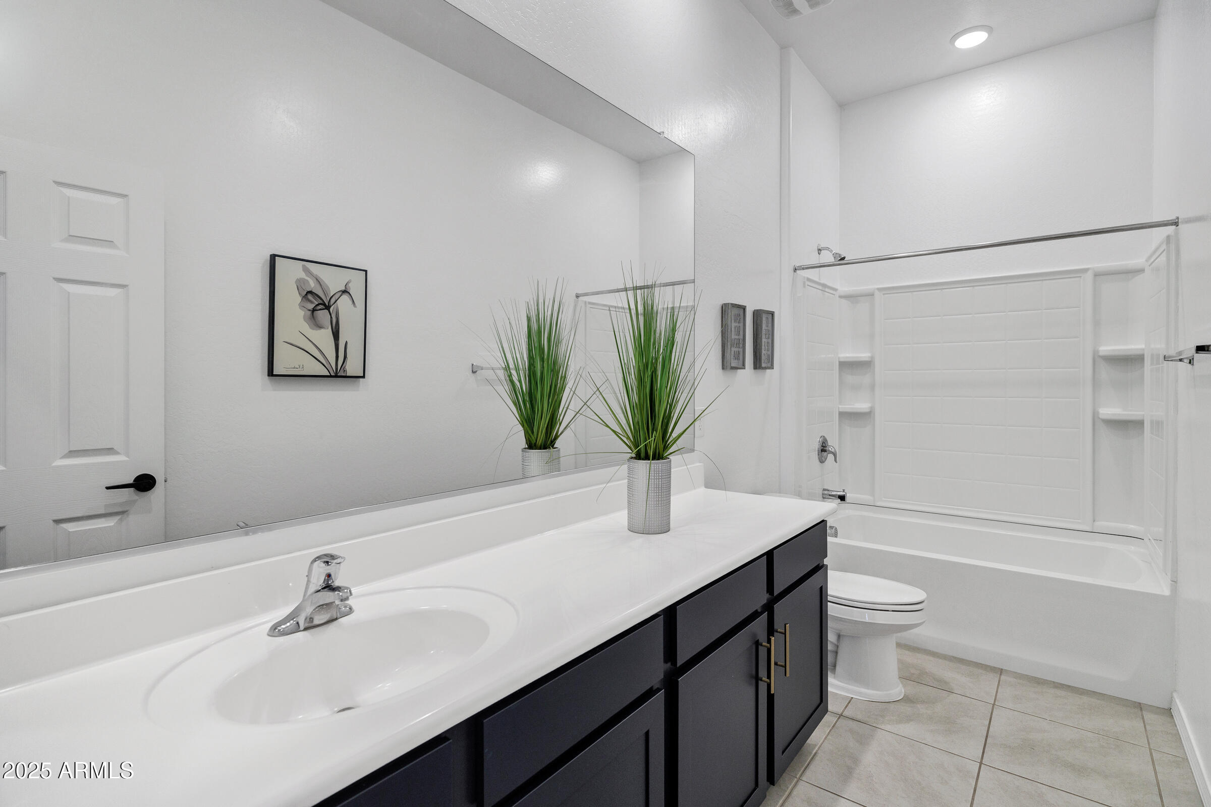 23025 East Happy Road Queen Creek, AZ 85142 - Photo 18 of 31 a bathroom with a sink a toilet and tub