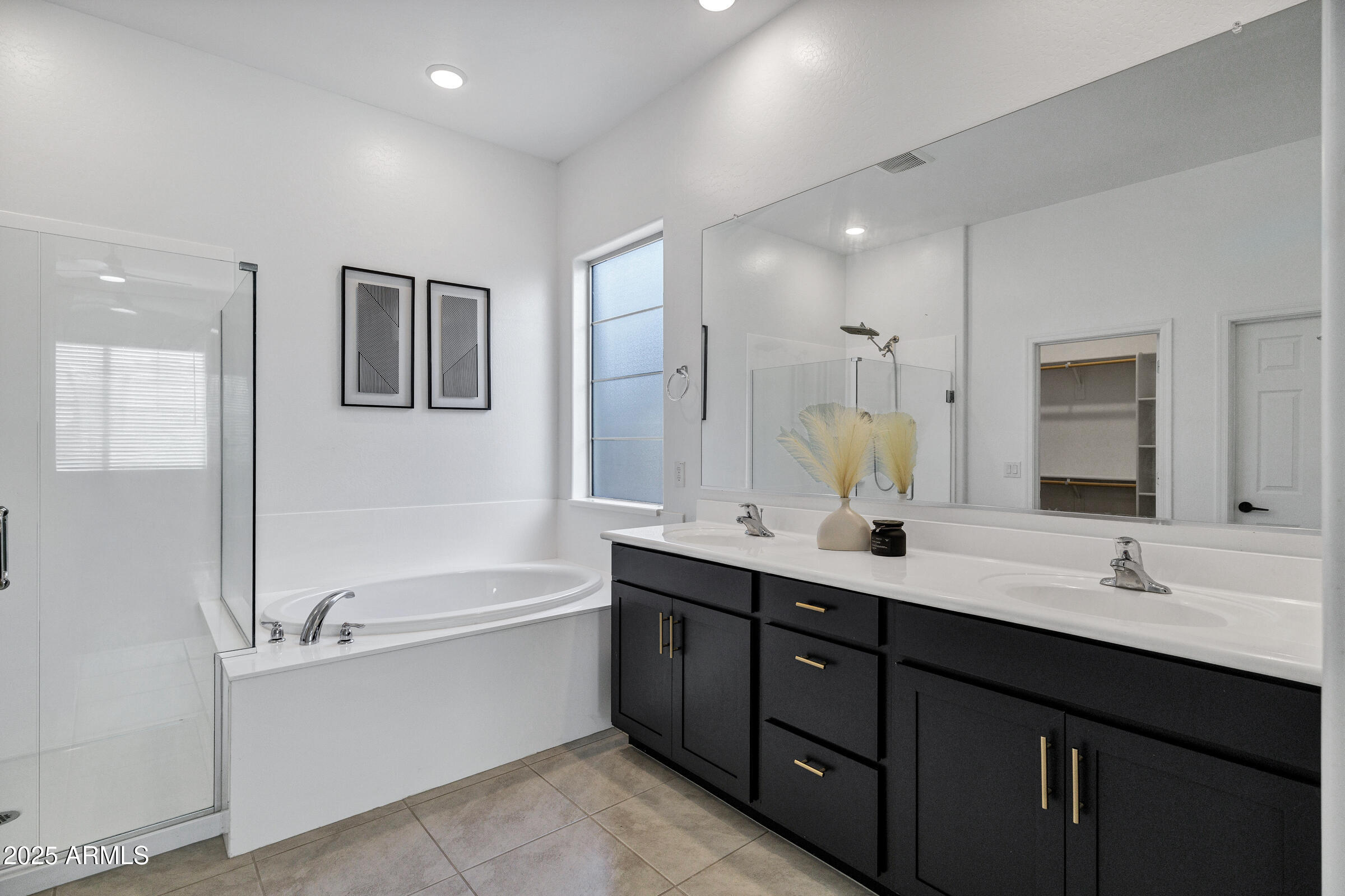 23025 East Happy Road Queen Creek, AZ 85142 - Photo 20 of 31 a bathroom with a tub sink double vanity granite and a mirror