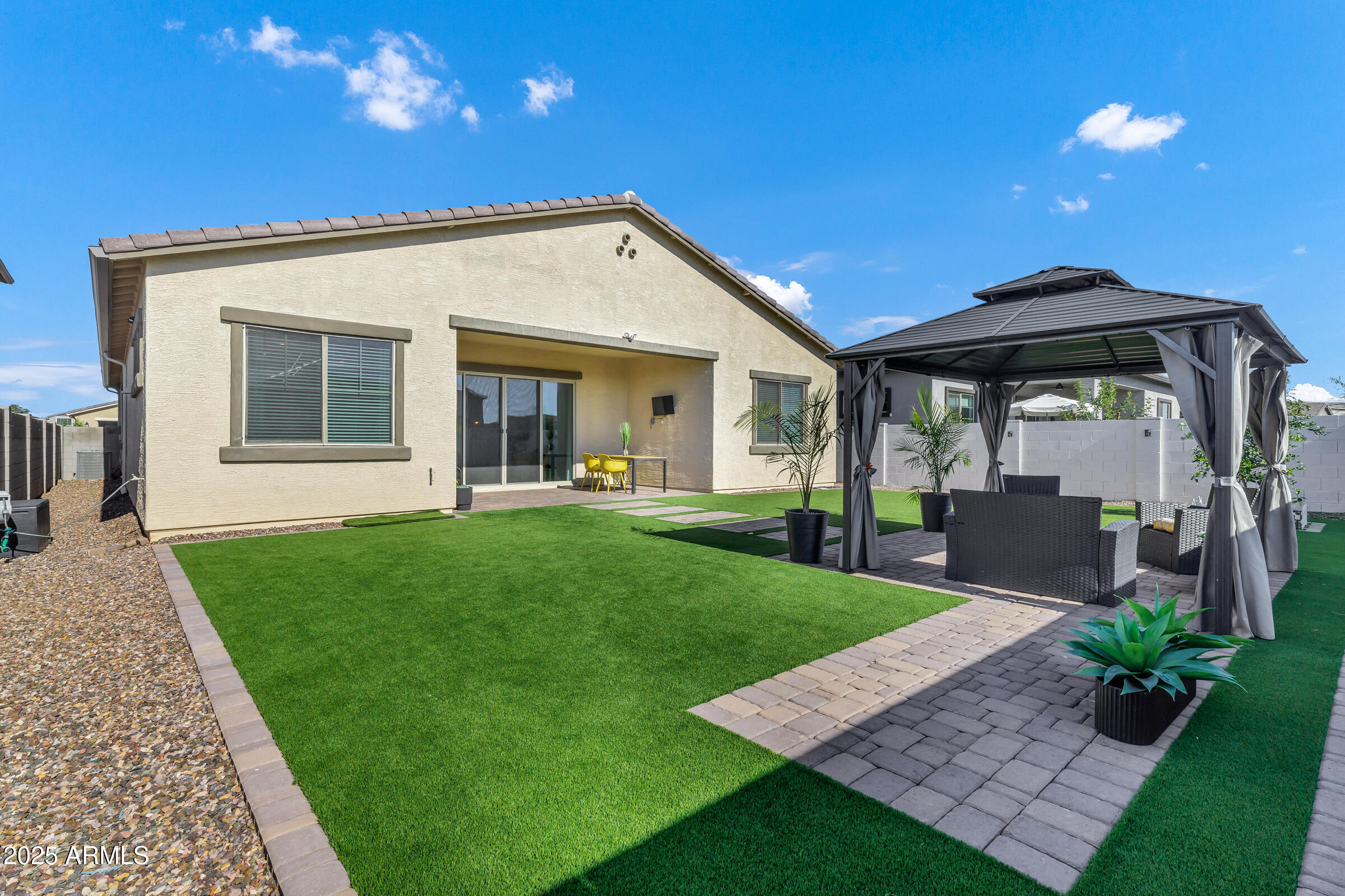 23025 East Happy Road Queen Creek, AZ 85142 - Photo 22 of 31 a view of a house with a yard