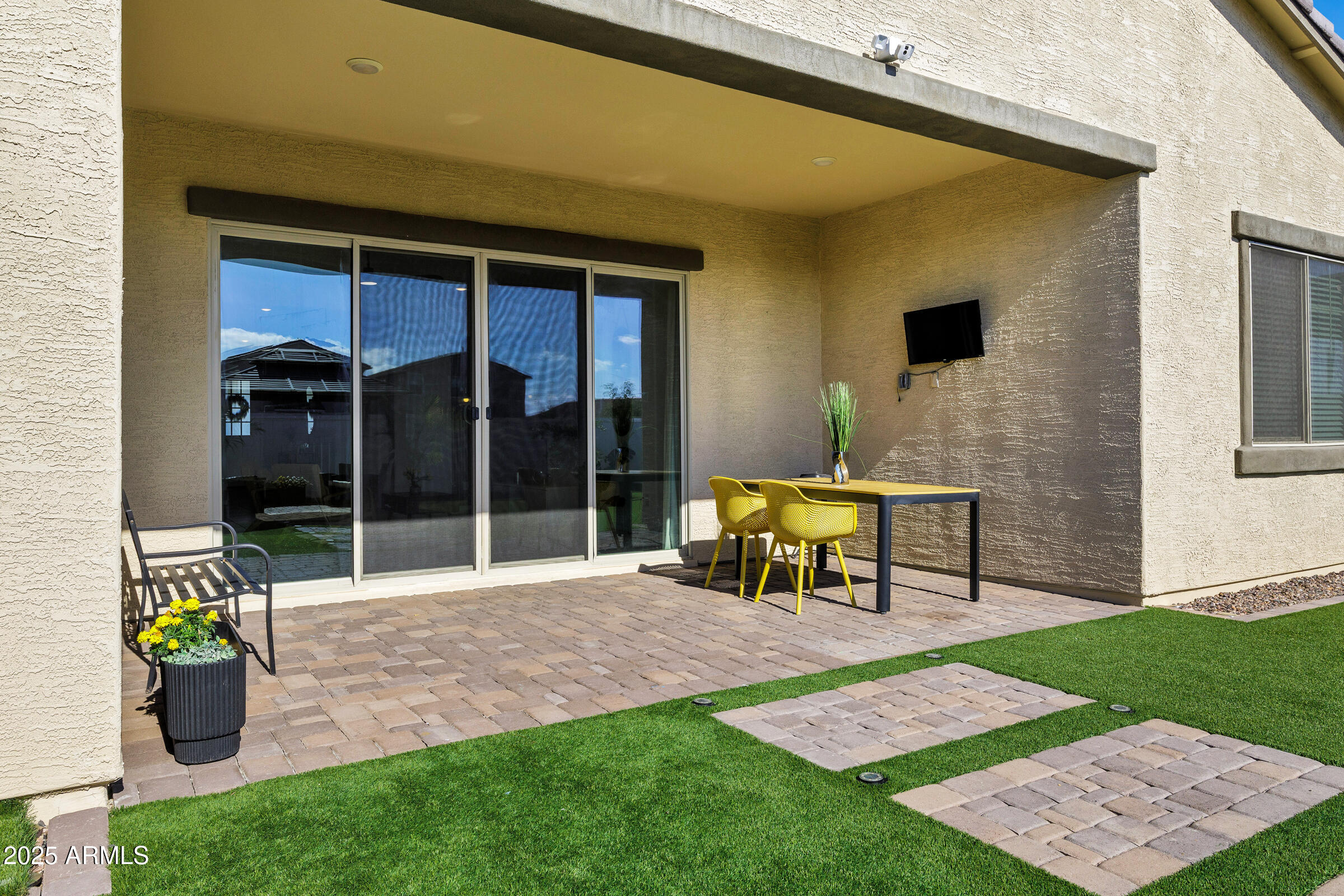 23025 East Happy Road Queen Creek, AZ 85142 - Photo 23 of 31 a view of a patio with table and chairs near a yard