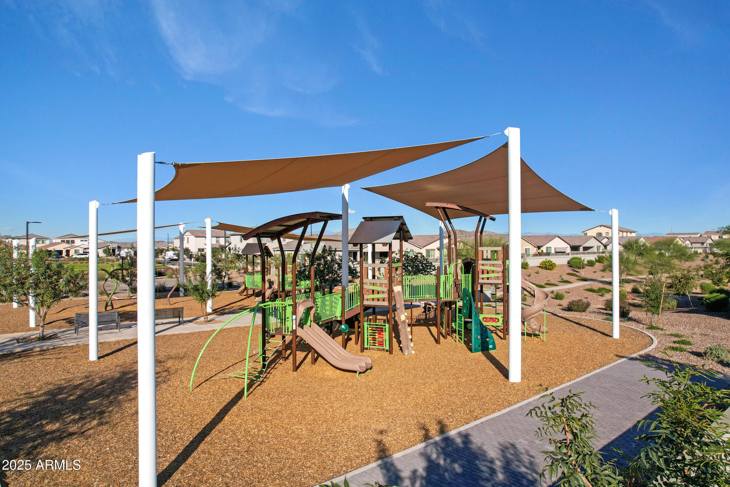 23025 East Happy Road Queen Creek, AZ 85142 - Photo 25 of 31 a view of a patio with a table and chairs under an umbrella