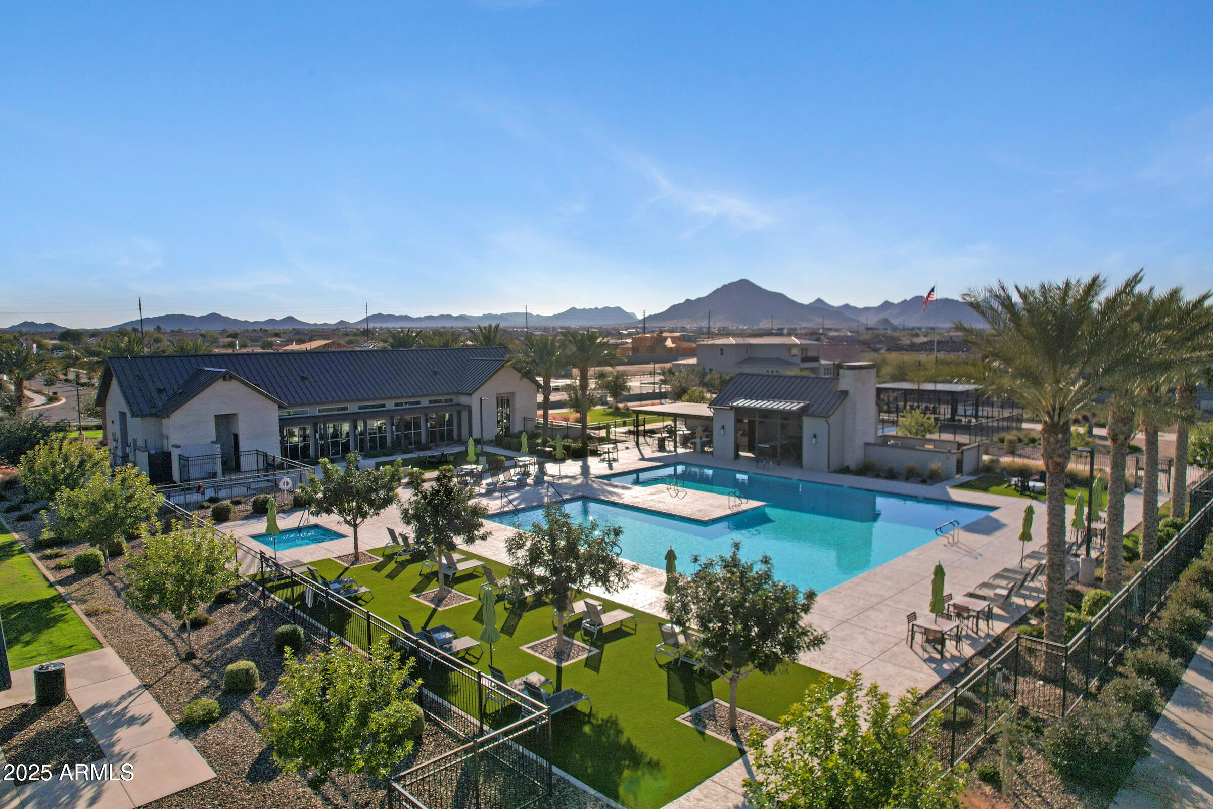 23025 East Happy Road Queen Creek, AZ 85142 - Photo 26 of 31 a view of a lake with a house in the background