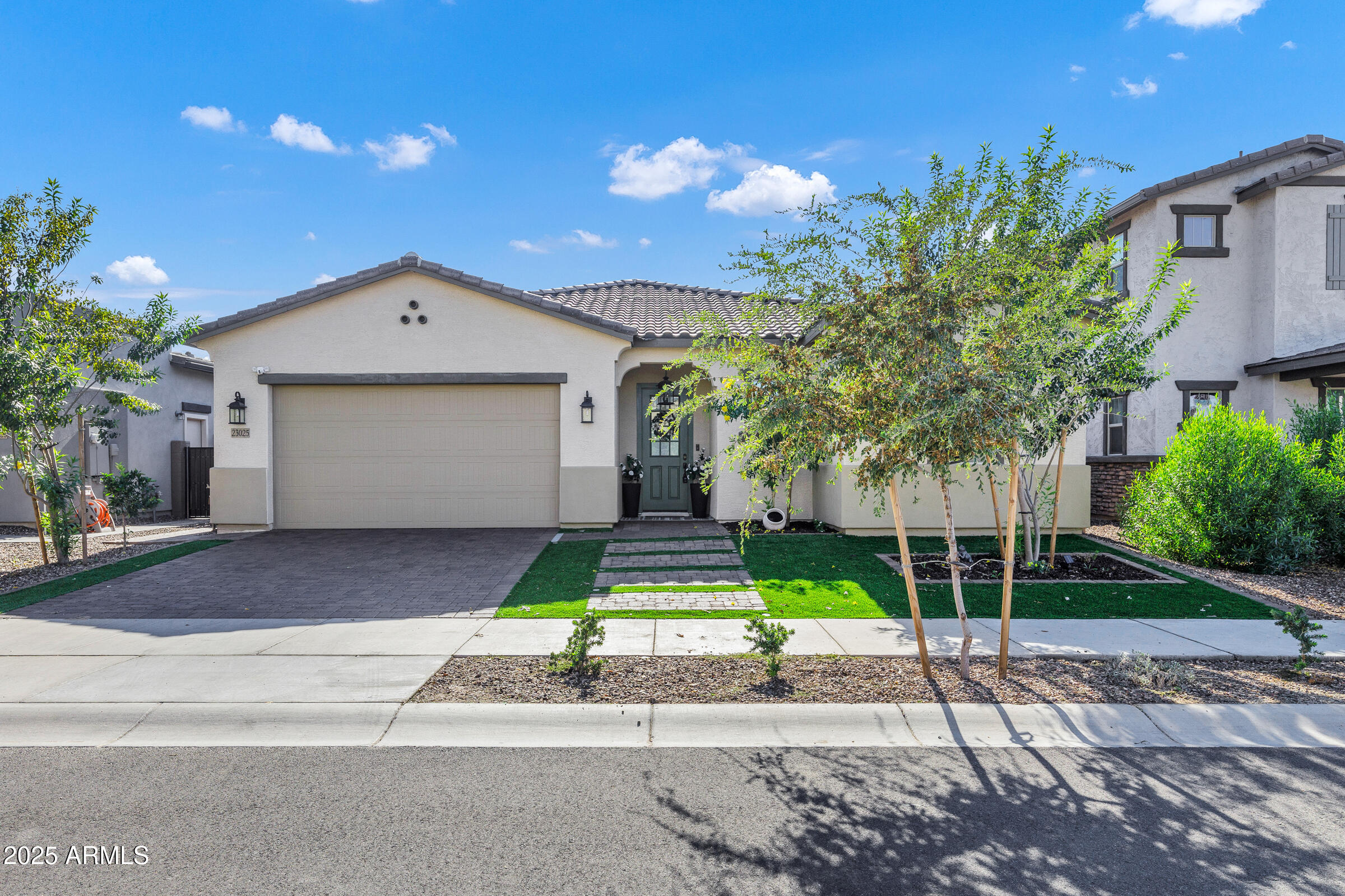 23025 East Happy Road Queen Creek, AZ 85142 - Photo 2 of 31 a front view of house with a garden