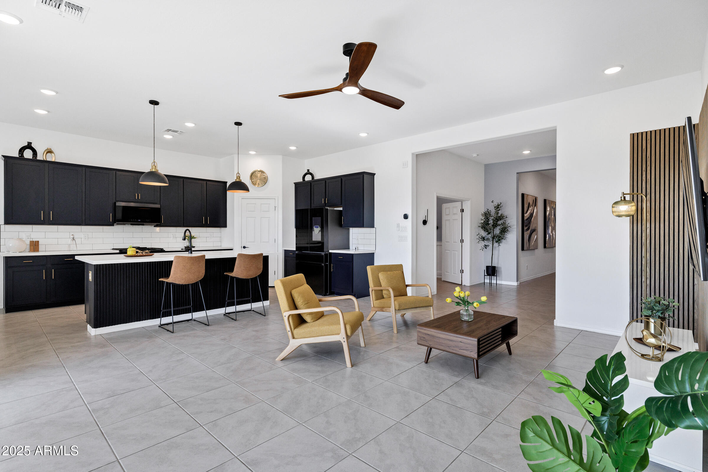 23025 East Happy Road Queen Creek, AZ 85142 - Photo 7 of 31 a living room with furniture kitchen view and a chandelier