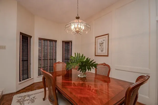a dining room with furniture and window