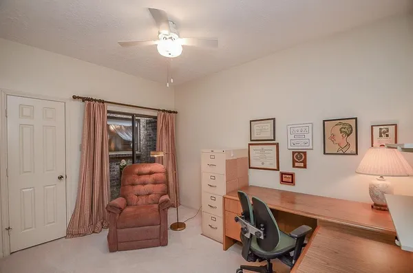 a view of a workspace with furniture and a livingroom