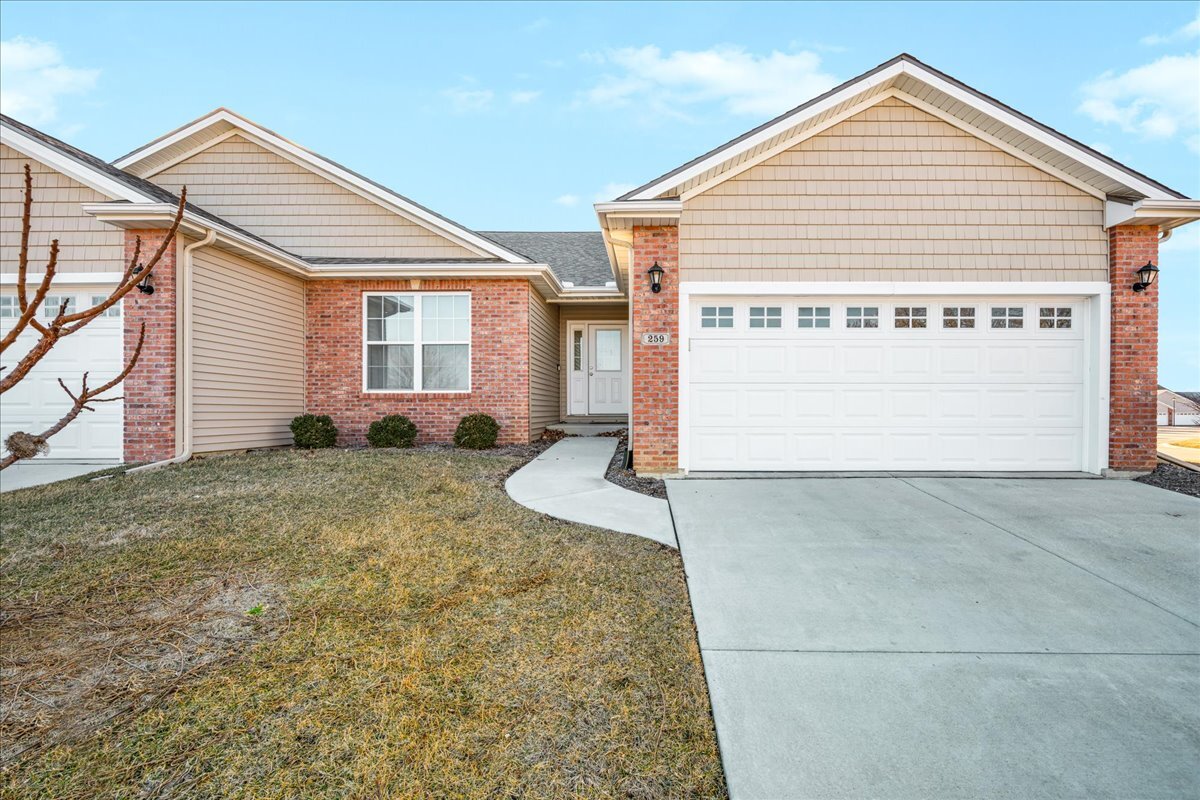 259 Cassidy Road Normal, IL 61761 - Photo 1 of 28 a view of a house with a yard and garage