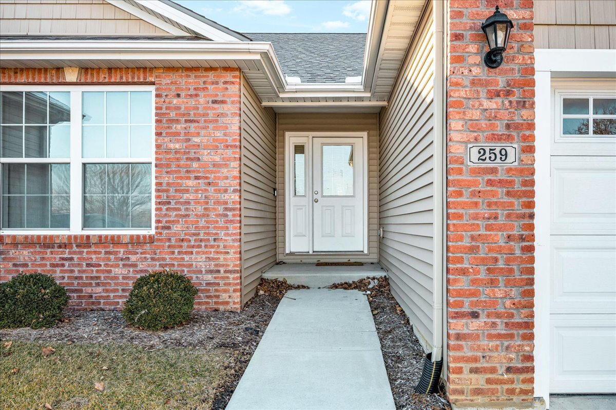 259 Cassidy Road Normal, IL 61761 - Photo 2 of 28 a view of a brick house with potted plants