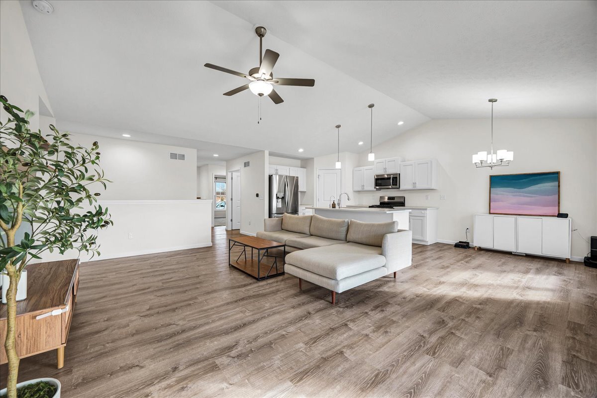 259 Cassidy Road Normal, IL 61761 - Photo 6 of 28 a living room with furniture and a chandelier