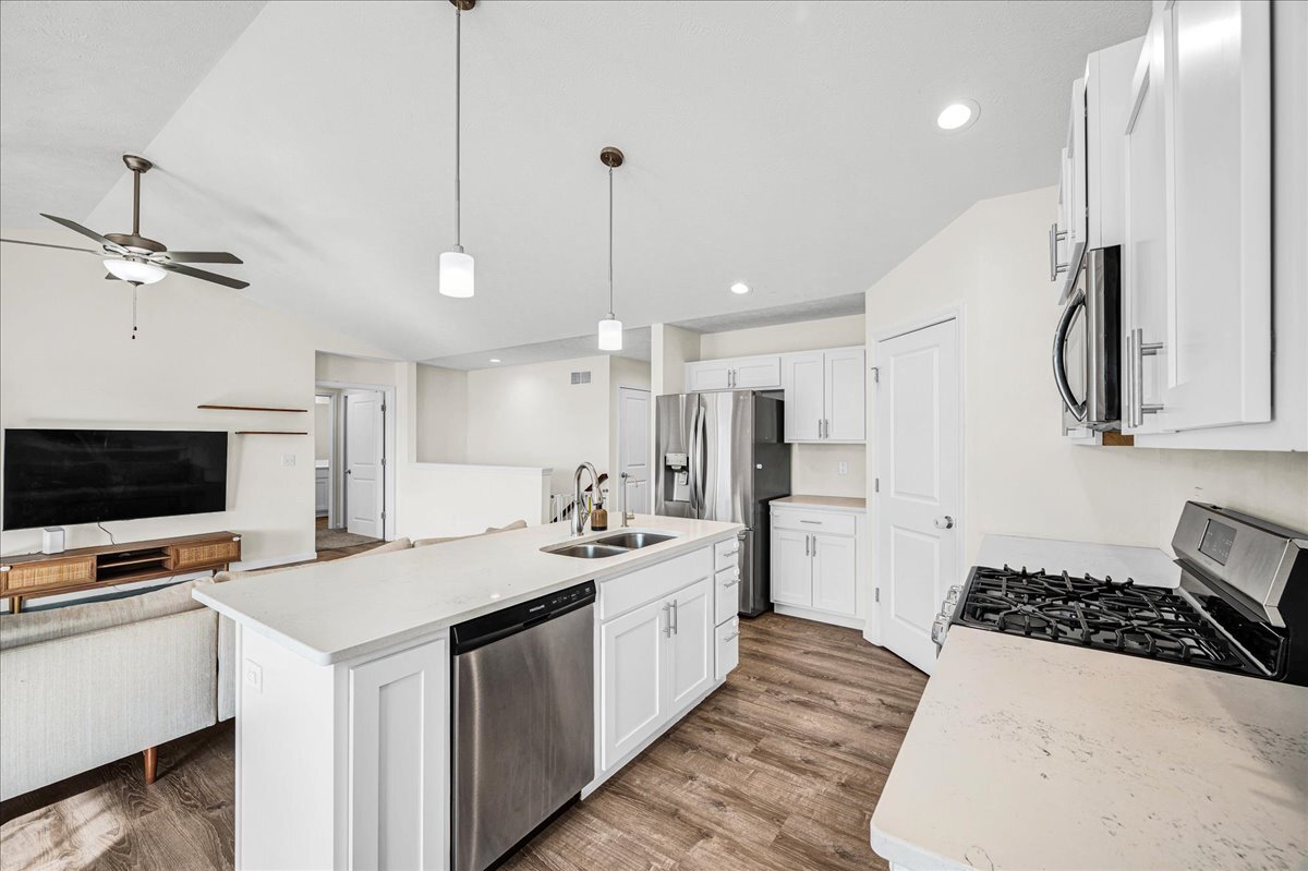 259 Cassidy Road Normal, IL 61761 - Photo 9 of 28 a kitchen with a sink a stove and a refrigerator