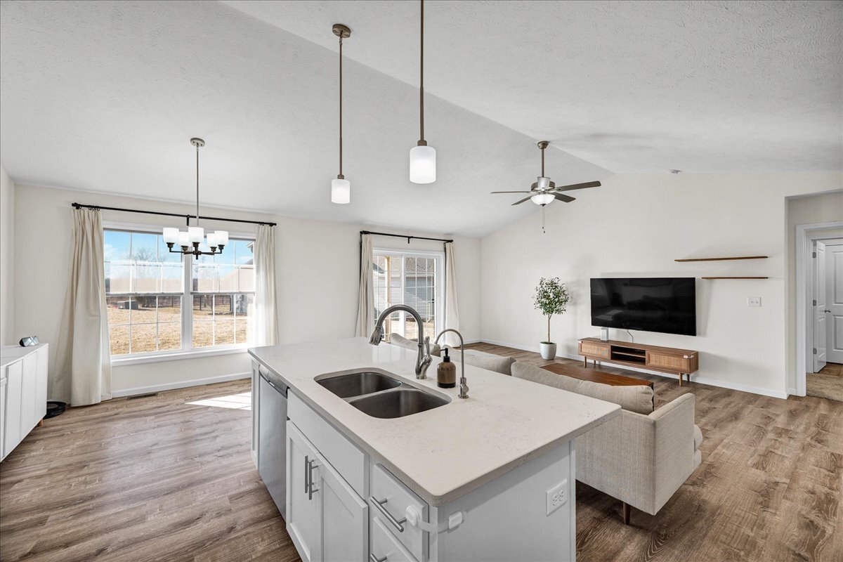 259 Cassidy Road Normal, IL 61761 - Photo 10 of 28 a kitchen with a sink a counter top space and living room view