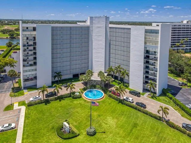 a view of a backyard with plants and a garden