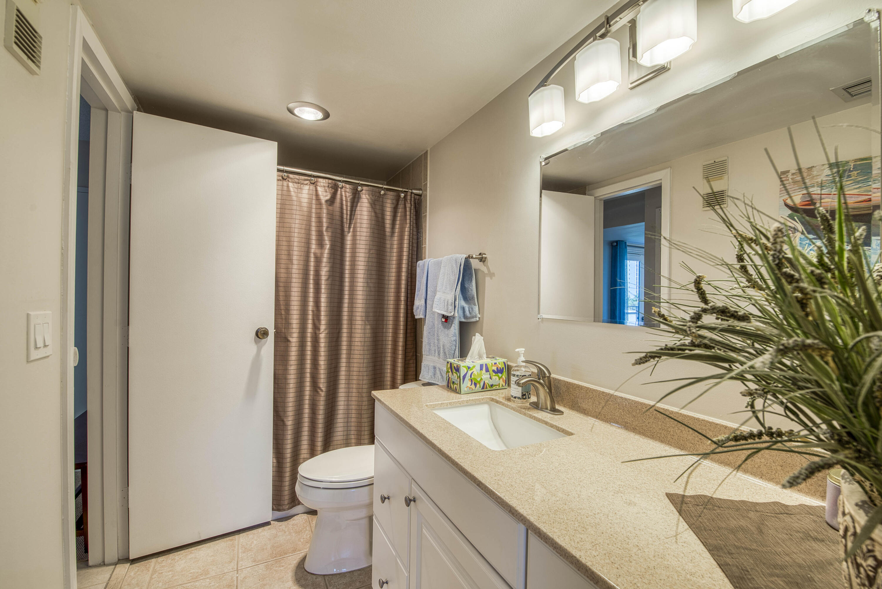 336 Golfview Road, Unit 518 North Palm Beach, FL 33408 - Photo 17 of 31 a bathroom with a sink a toilet and shower