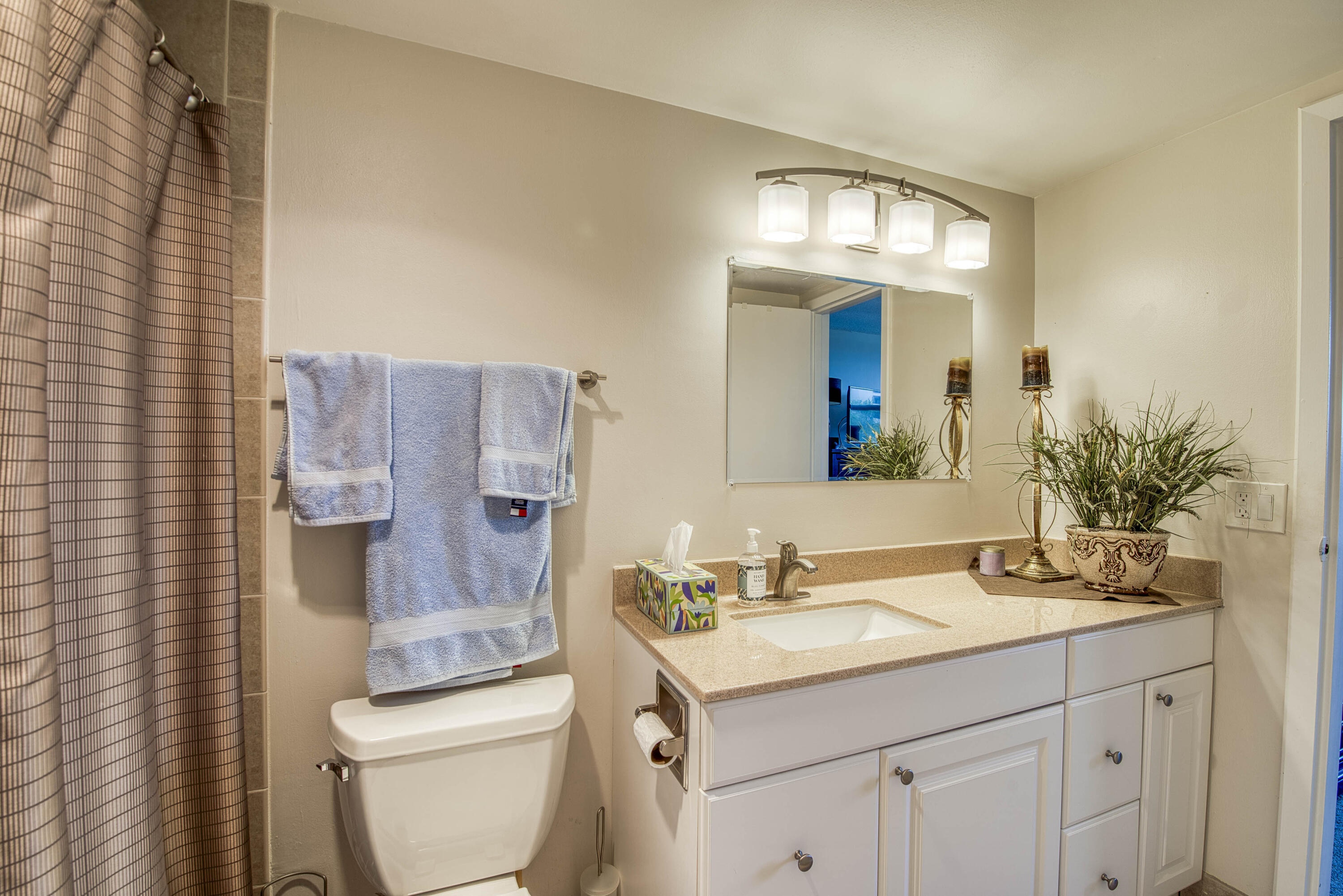336 Golfview Road, Unit 518 North Palm Beach, FL 33408 - Photo 18 of 31 a bathroom with a sink vanity and toilet