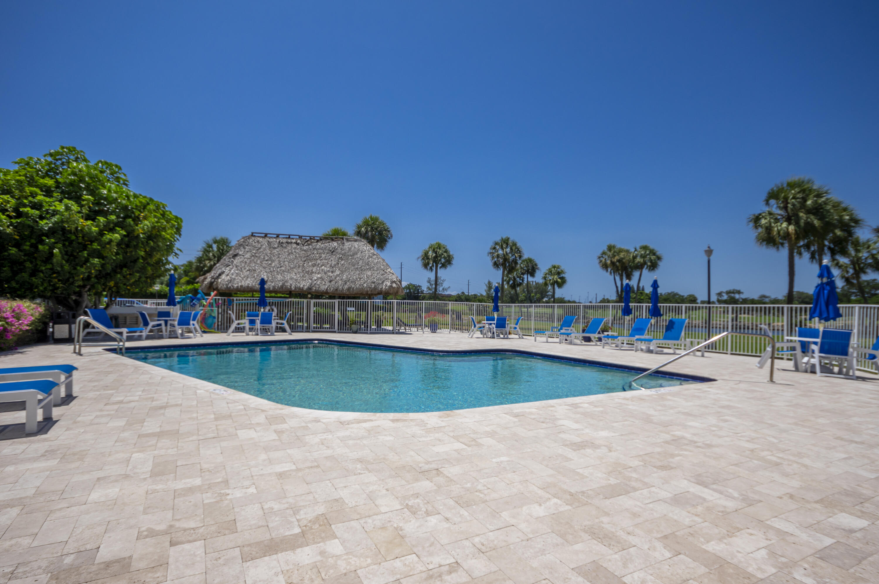 336 Golfview Road, Unit 518 North Palm Beach, FL 33408 - Photo 26 of 31 a view of a swimming pool with outdoor seating