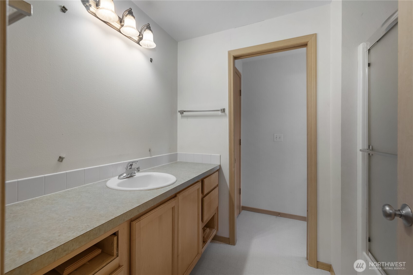 4604 20th Way Northeast Olympia, WA 98516 - Photo 19 of 34 a bathroom with a sink double vanity and a mirror