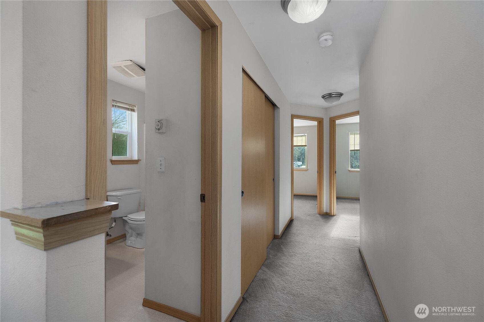 4604 20th Way Northeast Olympia, WA 98516 - Photo 20 of 34 a view of a hallway with wooden shelves