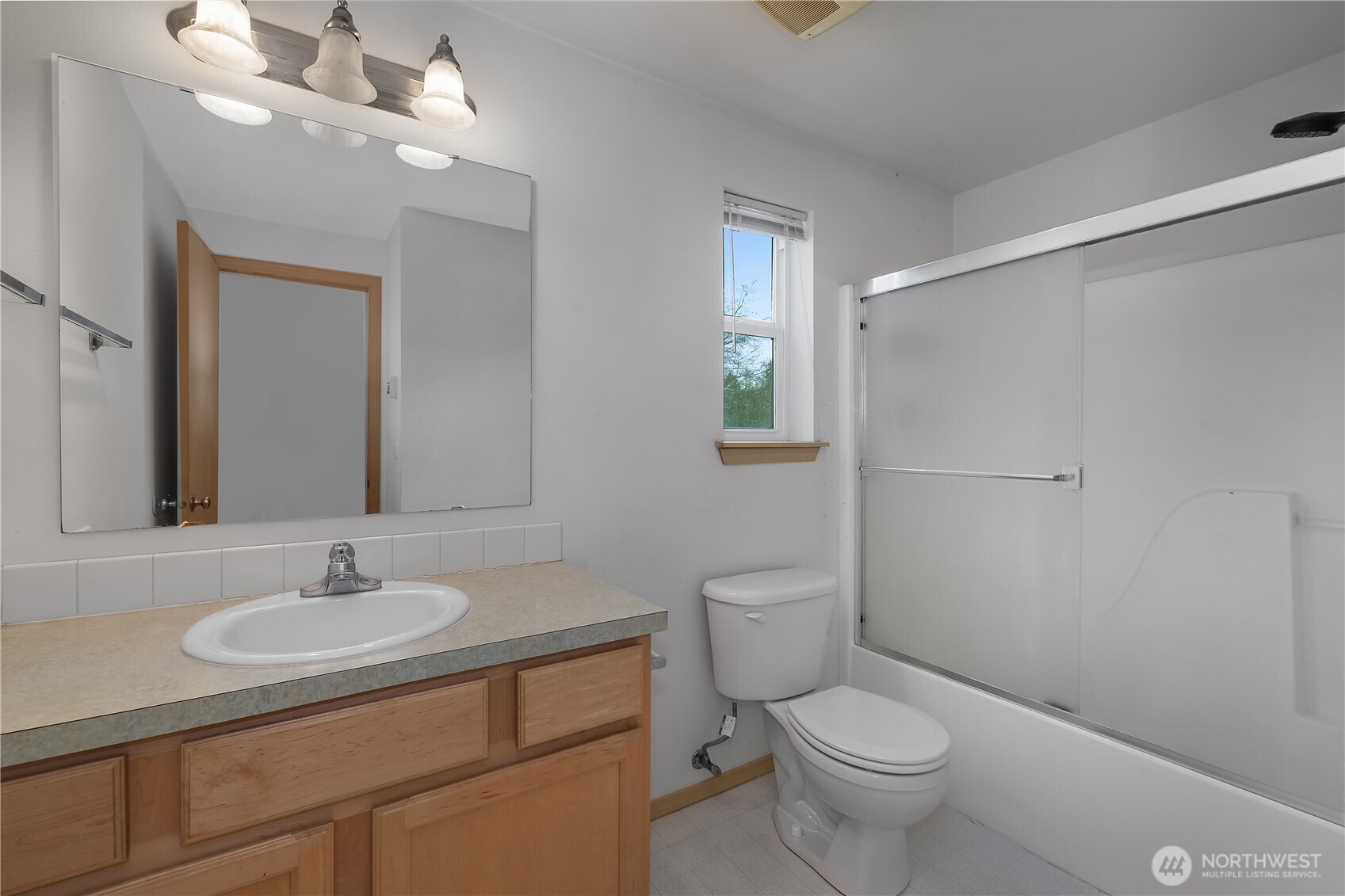 4604 20th Way Northeast Olympia, WA 98516 - Photo 21 of 34 a bathroom with a toilet a sink and mirror