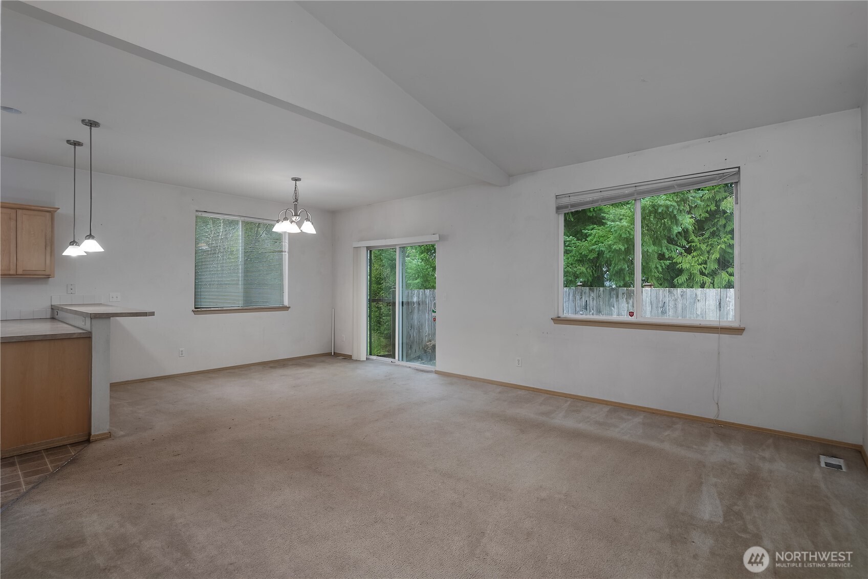 4604 20th Way Northeast Olympia, WA 98516 - Photo 4 of 34 an empty room with windows and chandelier