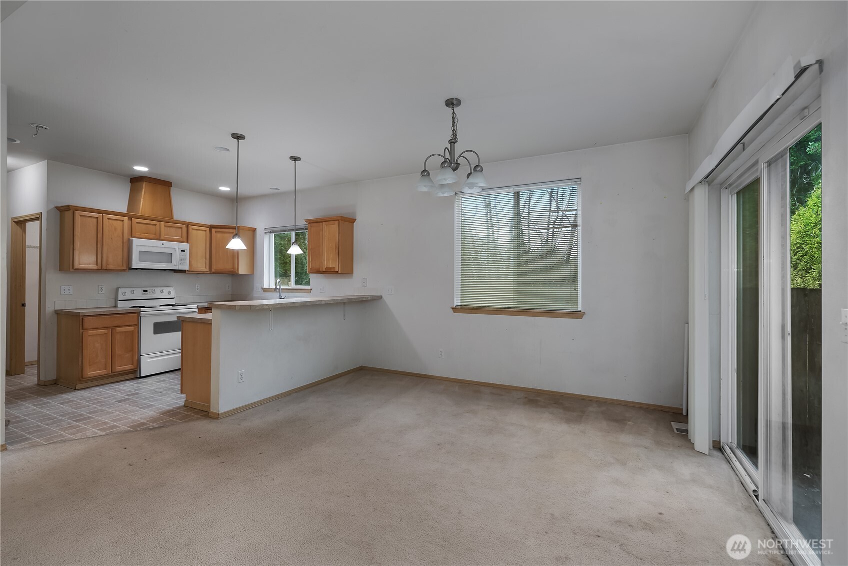 4604 20th Way Northeast Olympia, WA 98516 - Photo 6 of 34 a view of a kitchen with a sink a refrigerator and window