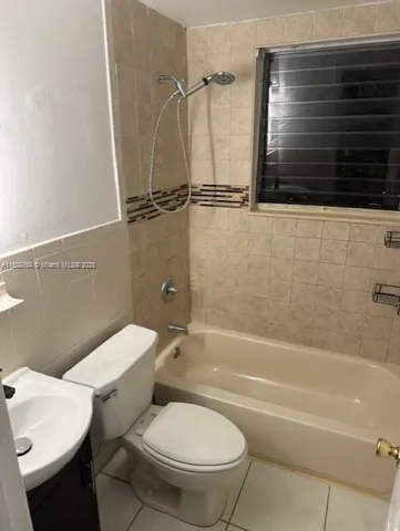 a bathroom with a toilet a sink and a shower