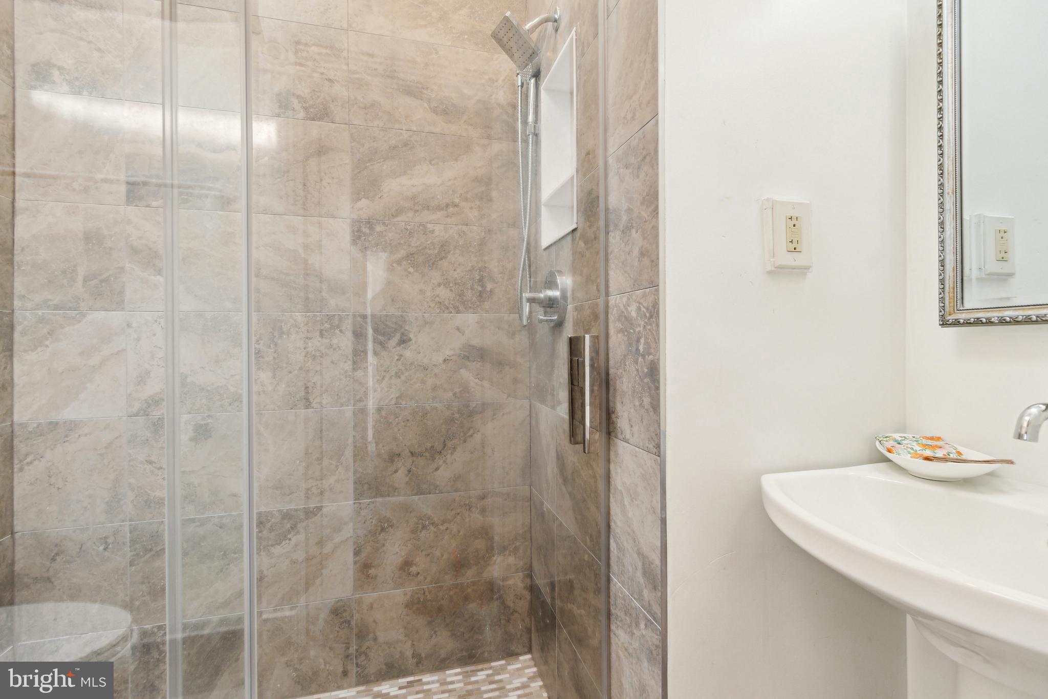 1244 34th Street Northwest Washington, DC 20007 - Photo 19 of 26 a bathroom with a sink and a mirror