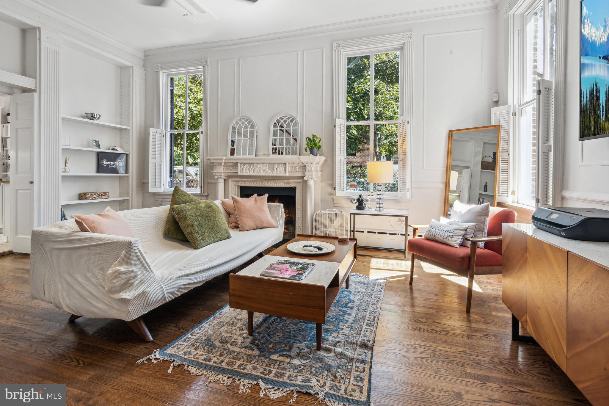 1244 34th Street Northwest Washington, DC 20007 - Photo 6 of 26 a living room with furniture and a fireplace