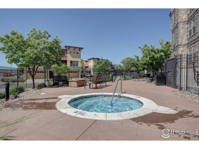 a swimming pool with outdoor seating