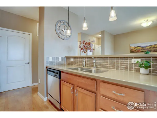 a view of kitchen with cabinets and wooden floor