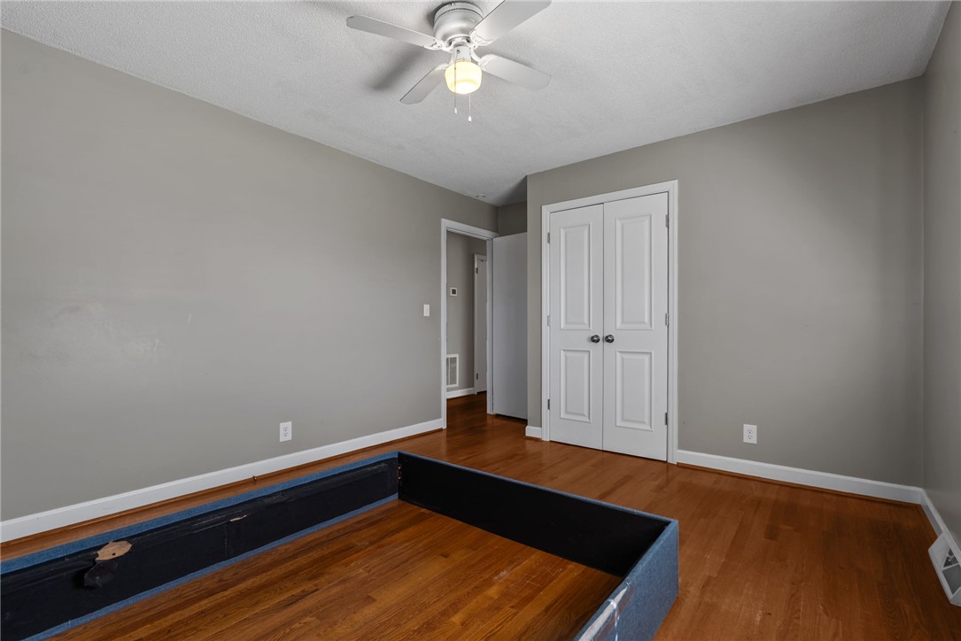 300 Green Street Williamston, SC 29697 - Photo 18 of 47 This spacious bedroom features lustrous hardwood floors and a convenient ceiling fan for ultimate comfort.