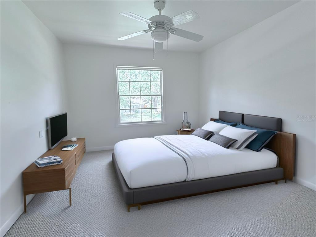 6206 Dewdrop Way Temple Terrace, FL 33617 - Photo 11 of 23 a bedroom with a bed and a chandelier