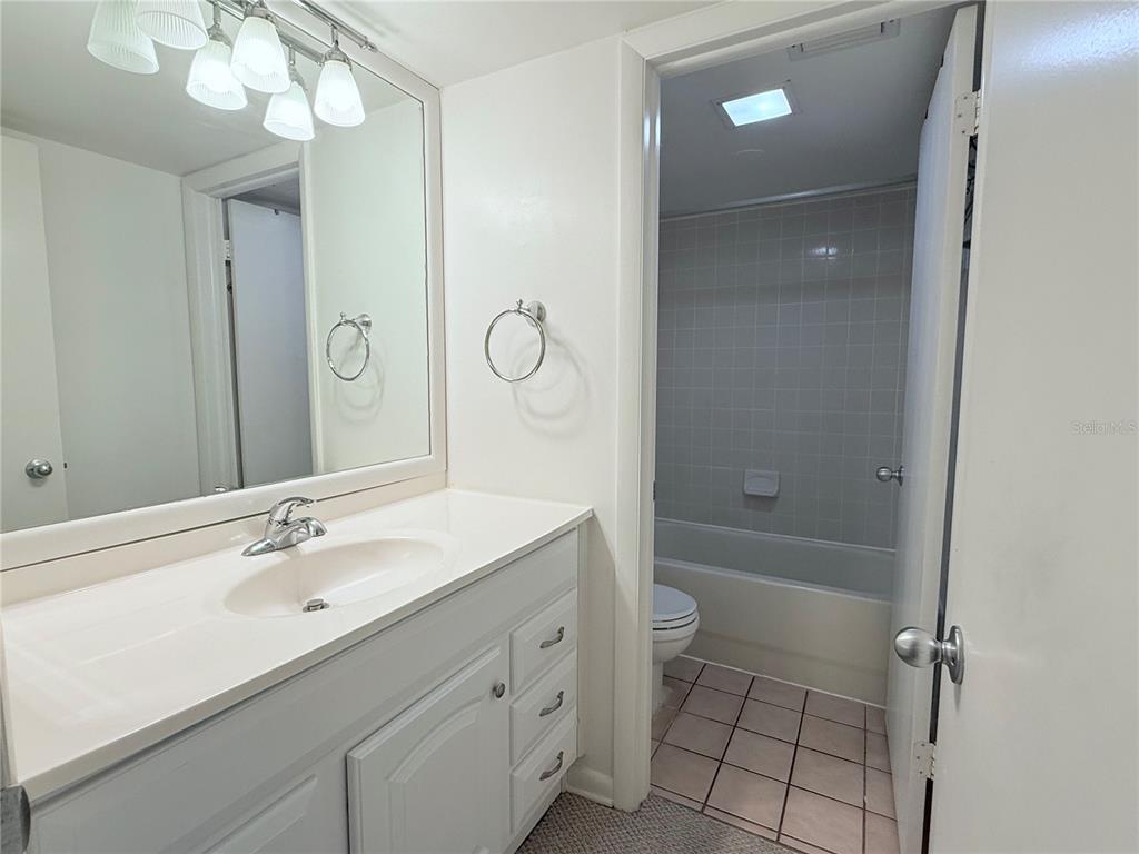 6206 Dewdrop Way Temple Terrace, FL 33617 - Photo 14 of 23 a bathroom with a sink a toilet and shower