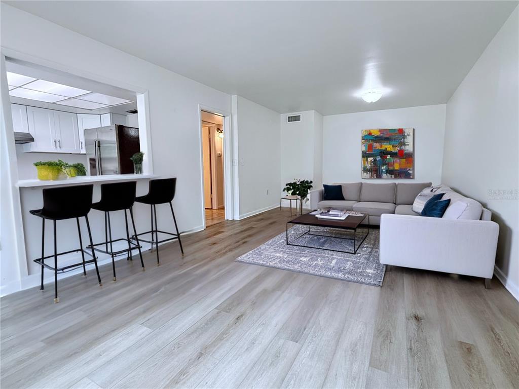 6206 Dewdrop Way Temple Terrace, FL 33617 - Photo 3 of 23 a living room with furniture and wooden floor