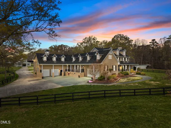 a kitchen with stainless steel appliances granite countertop a sink a stove and a wooden floors