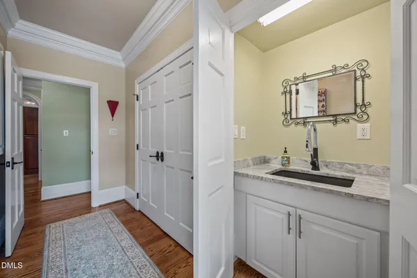 a bathroom with a sink a vanity and a mirror