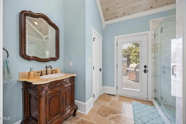 a bathroom with a sink a vanity and a toilet