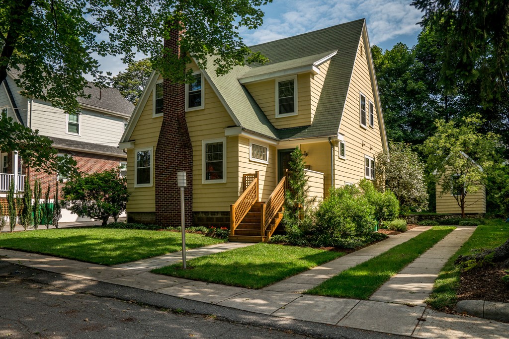 a front view of a house with garden