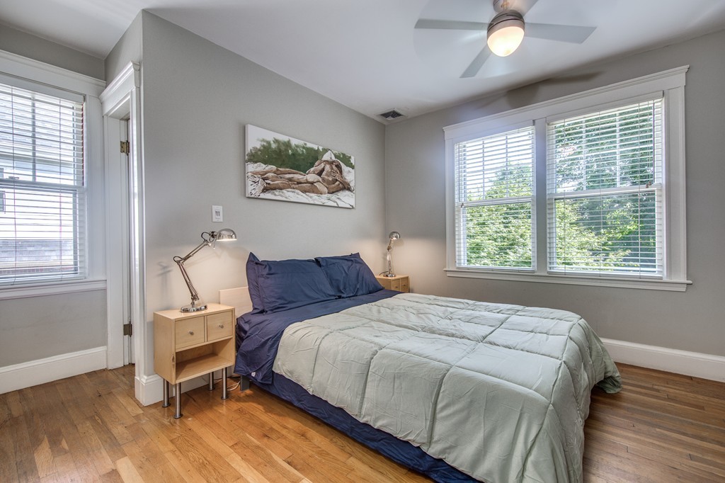 67 Cedar Road Medford, MA 02155 - Photo 15 of 30 a bed sitting in a bedroom next to a window