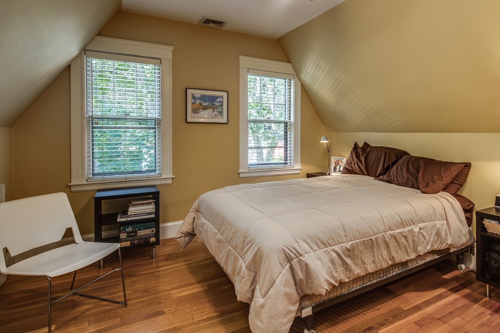 67 Cedar Road Medford, MA 02155 - Photo 20 of 30 a bedroom with a bed and windows