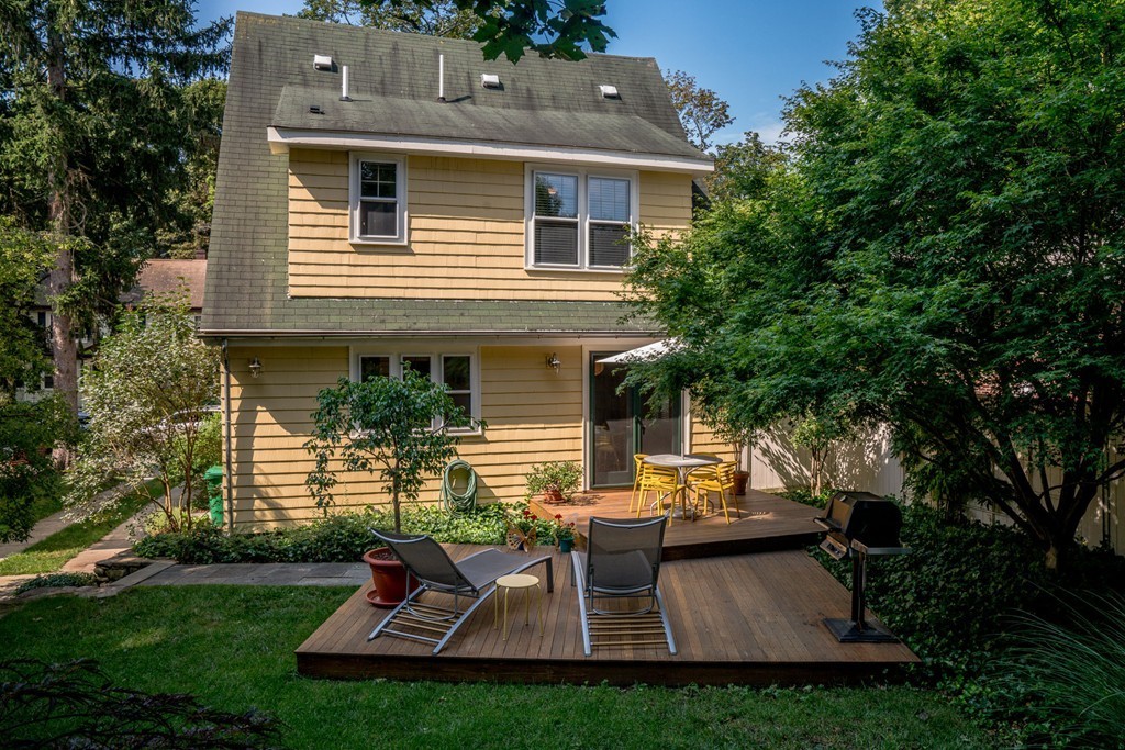 67 Cedar Road Medford, MA 02155 - Photo 24 of 30 a view of a house with backyard sitting area and garden