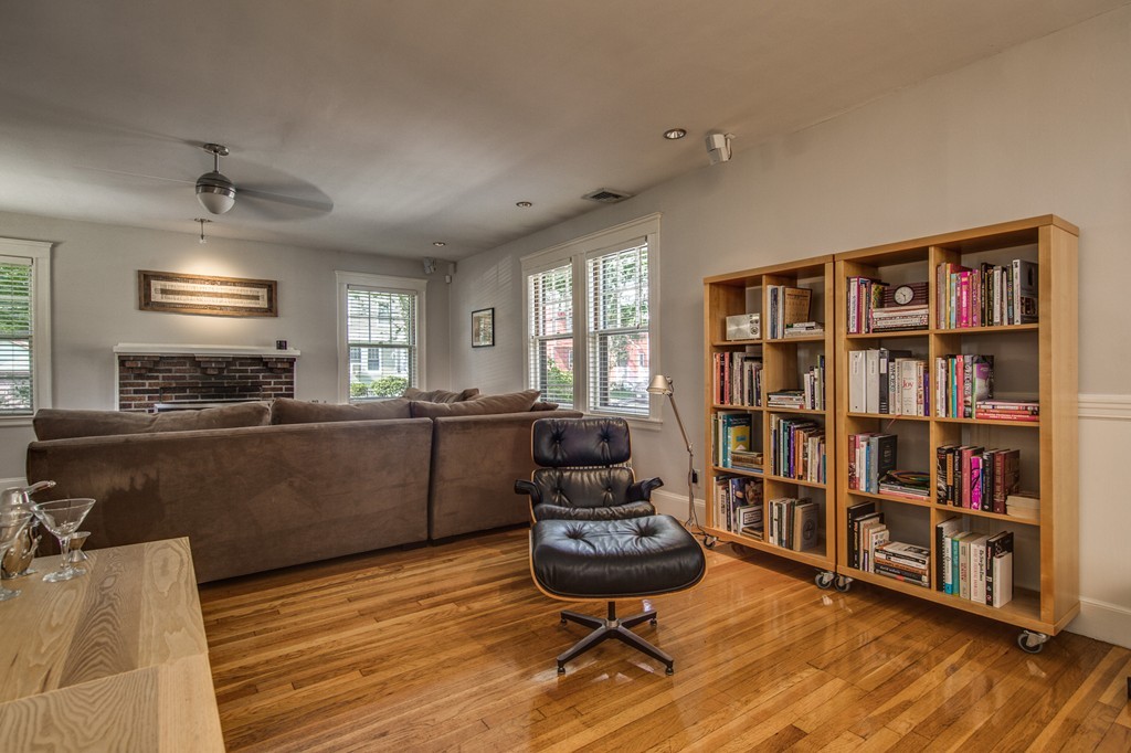 67 Cedar Road Medford, MA 02155 - Photo 6 of 30 a living room with furniture and a book shelf
