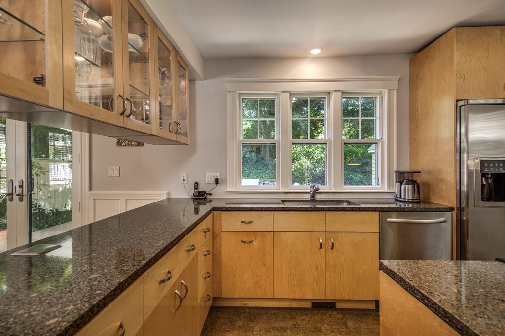 67 Cedar Road Medford, MA 02155 - Photo 9 of 30 a kitchen with stainless steel appliances granite countertop a sink and a large window