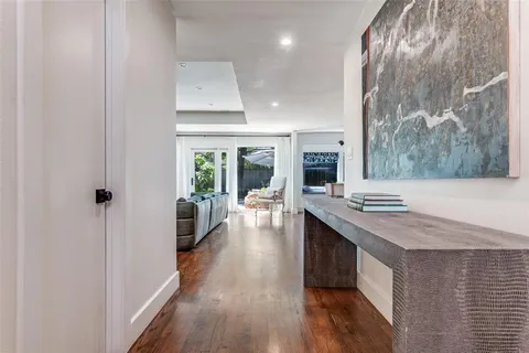 a kitchen with stainless steel appliances granite countertop a lot of counter space and wooden floors