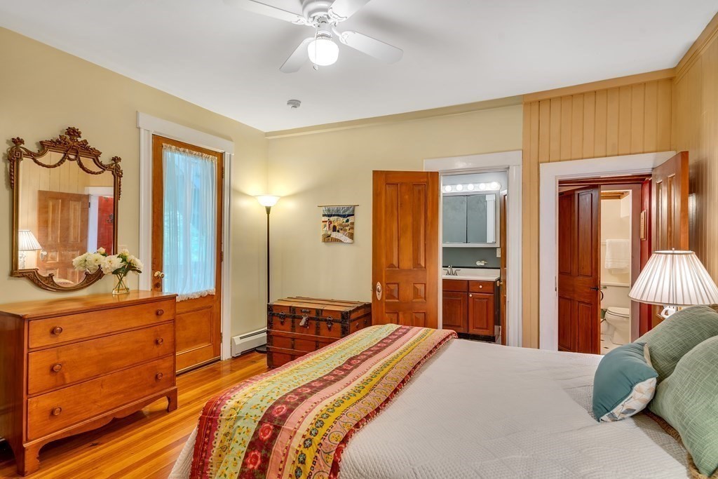 509 Neck Road, Unit 1 Lancaster, MA 01523 - Photo 12 of 19 a bedroom with a bed and a dresser